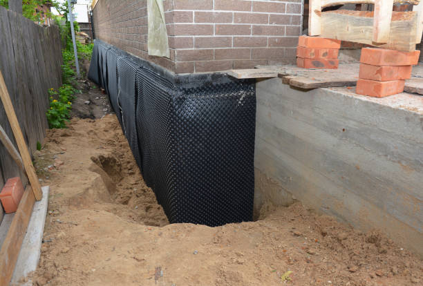 Happy homeowners after waterproofing job in Whitesburg